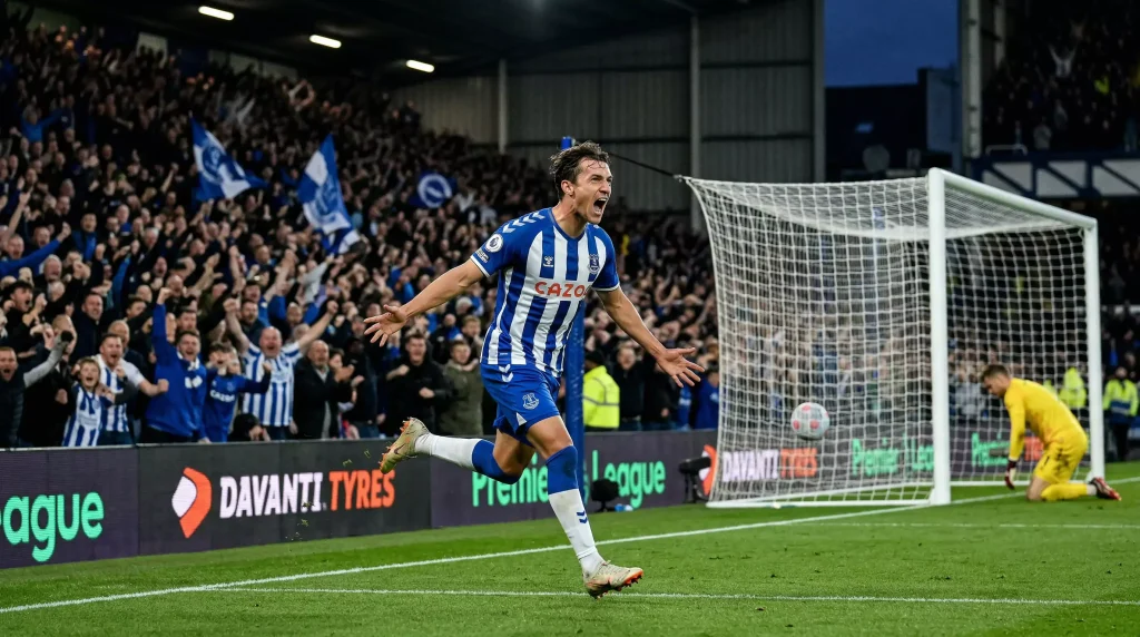 Delantero de fútbol celebrando el primer gol del partido en un estadio de la Premier League